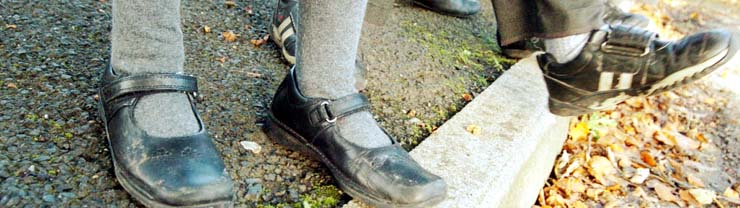 Children's feet crossing the road