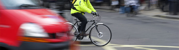 Cyclist riding through town