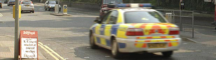 Police car driving on a road