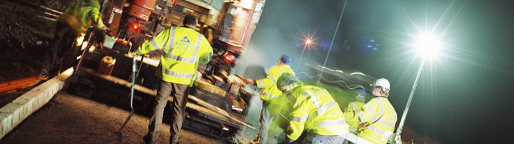 road workers resurfacing a road